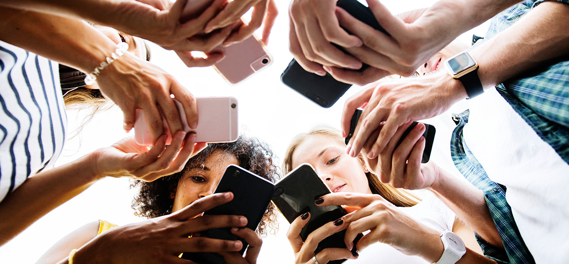 young people looking at smartphones
